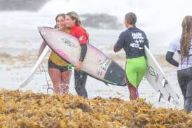 Conditions were not perfect at Woonona Beach but it didn't wipe the smile from competitors' faces. Picture by Adam McLean