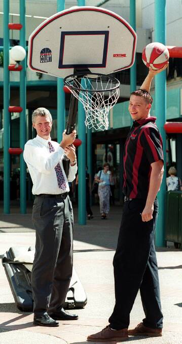 AS A ROOKIE: A young David Andersen with Hawks legend, and former general manager, Chuck Harmison at the launch of the 1998 season.