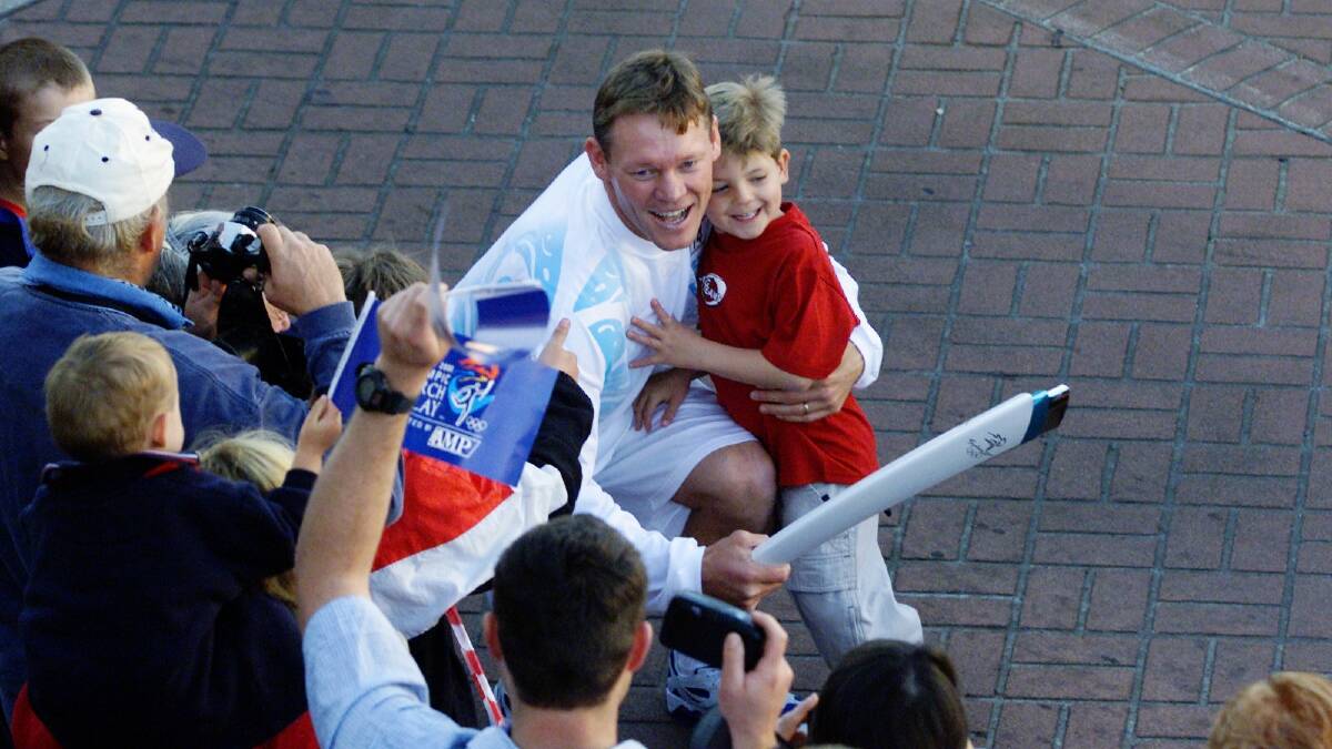 Happy memories: Steelers legend Rod Wishart with then four-year-old son Callum during the torch relay.
