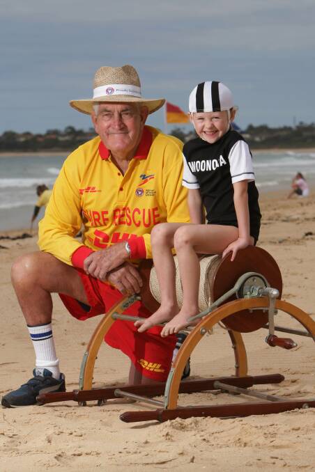 Inspiration: The veteran surf lifesaver with a young club member Jacinta Cliff in 2007.  Picture: Ken Robertson