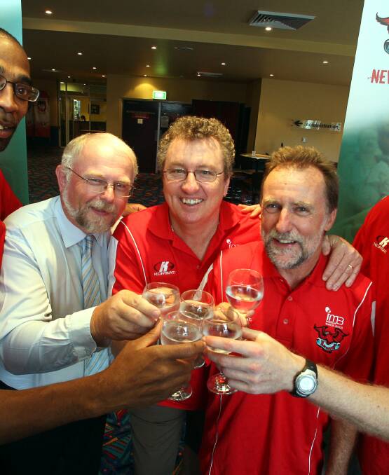 BULLET DODGED: Hawks shareholders Wayne Morris, Kyle Page and Richard Clifford celebrate the club's first Houdini act. Picture: Sylvia Liber. 