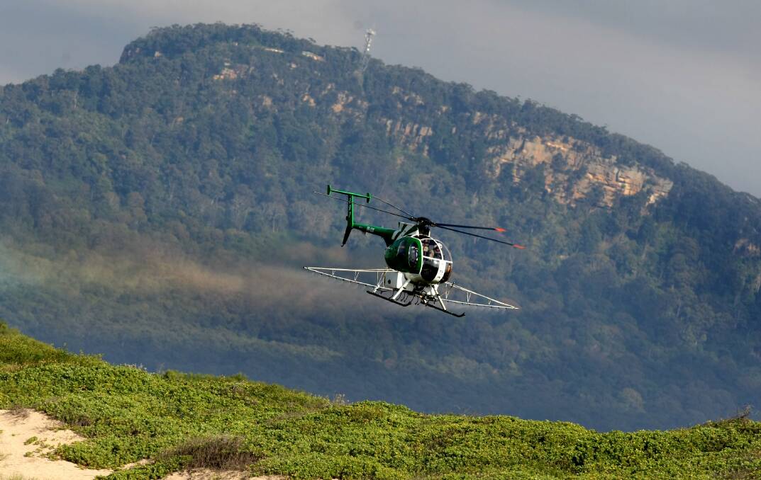 LONG-TERM: Aerial spraying by helicopter was controversial, even drawing street protests, when it was performed over East Corrimal Reserve in 2008.
