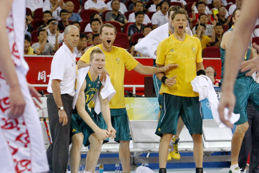 Golden days: Coach Brian Goorjian, David Barlow, Hawks great Glen Saville and David Andersen at the 2008 Olympics in Beijing. Picture: Dave Tease