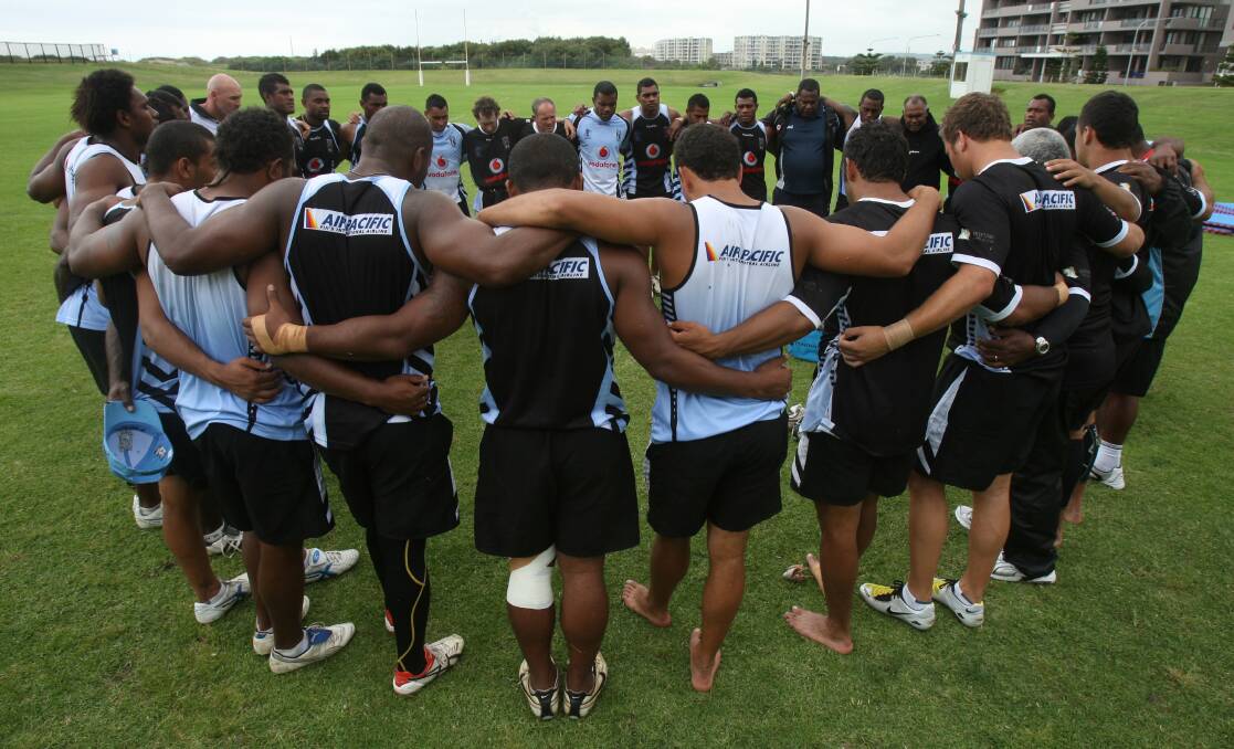 Uplifting: The Fiji squad pray after a training session at WIN Stadium in 2008.  Robert Peet