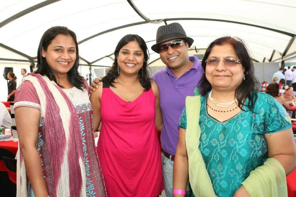 Mona Jagatramka (right) with Kunal Chandak (second reight) and friends at the Kembla Grange races in December 2010. 