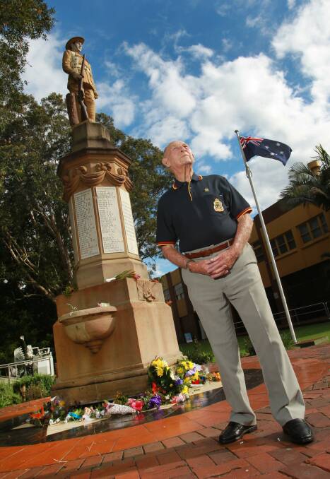 Proud Digger: Keith Woodward with the statue in the park that was named after him, near the railway station in Thirroul. Picture: ORLANDO CHIODO