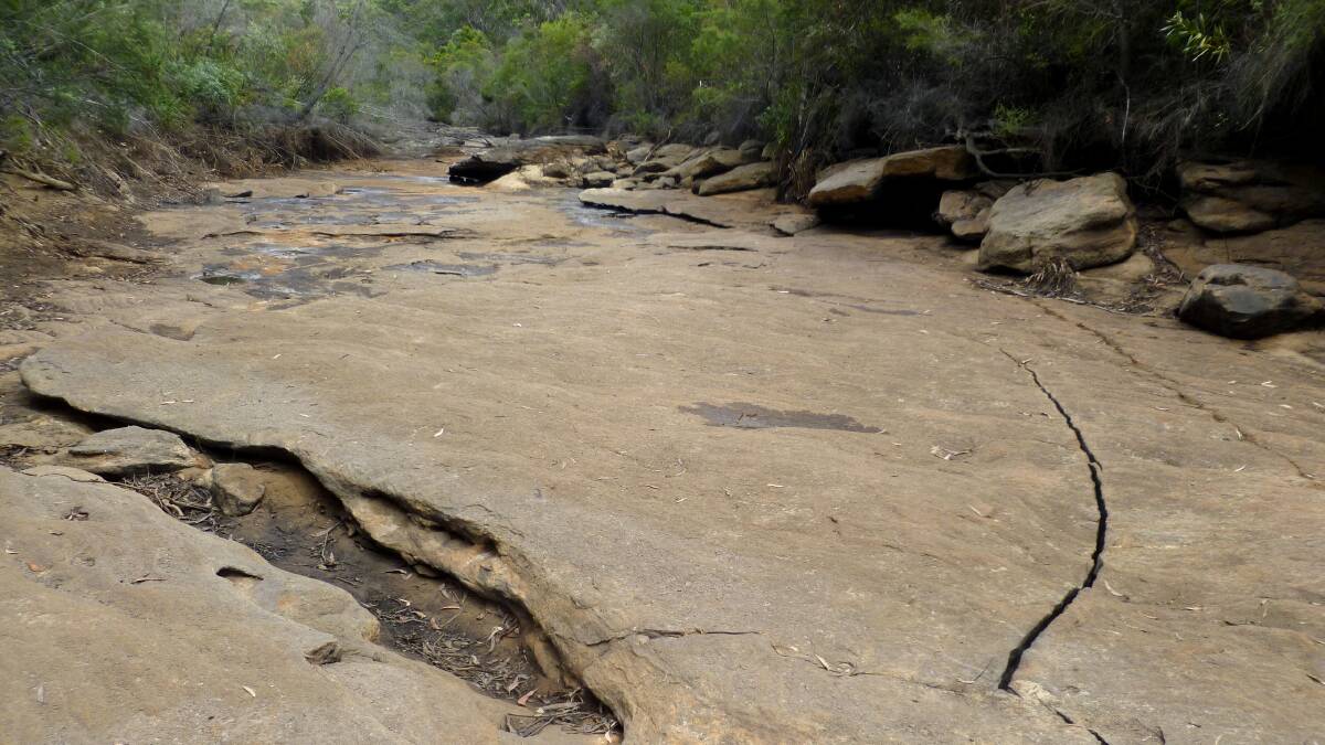 Underground impact: An example of creek bad cracking, in the Waratah Rivulet, nearby coal mining areas. This is not the area subject to the report in question.