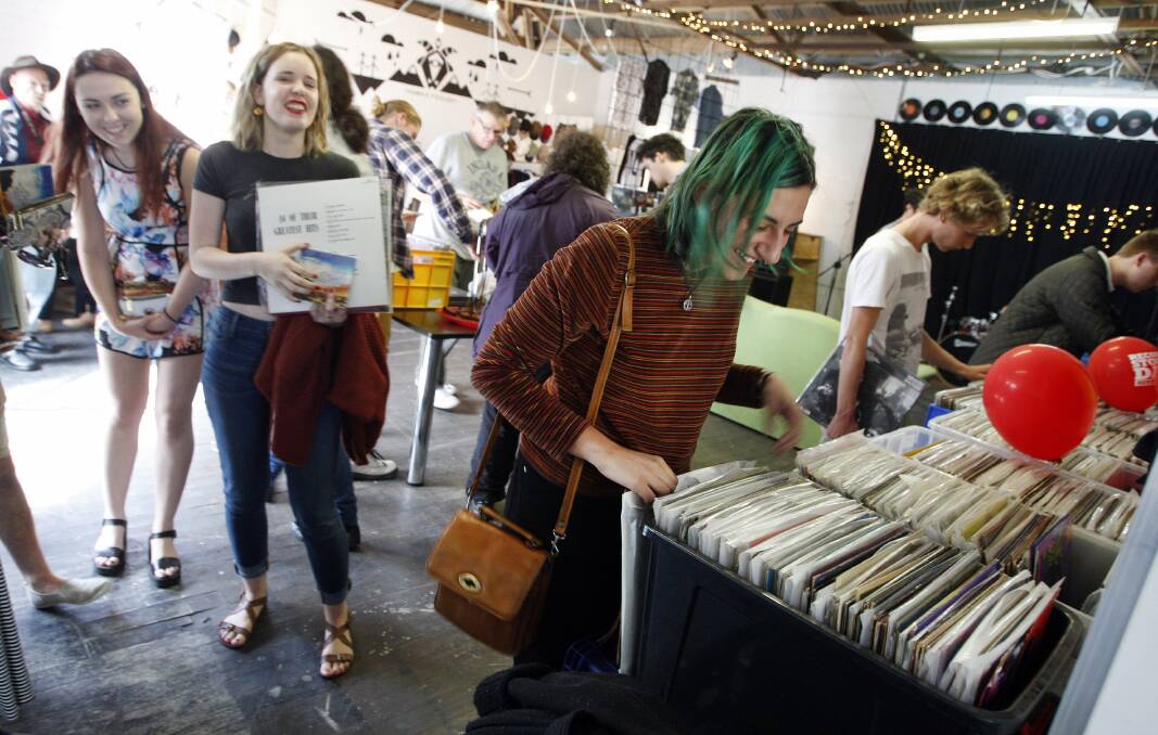FLASHBACK: Record Store Day 2014 sees fans scrounge record bins at Music Farmers's previous store on Crown Lane. Picture: Andy Zakeli