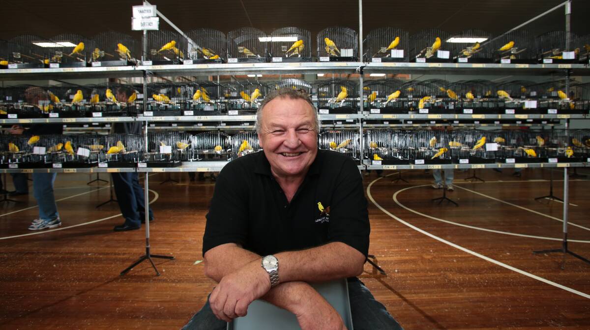 BIRD MAN: Wollongong and District Avicultural Society president John Walker and fellow members will host the club's 69th annual Bird Show at Bulli PCYC on Saturday, April 28. Picture: Adam Mclean