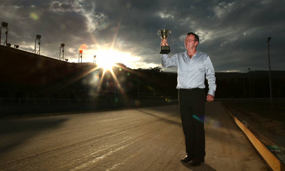 RACE TO THE FINISH LINE: Bulli operations manager Darren Hull holds the Cyril Rowe Gold Cup ahead of the event final this Saturday evening. Picture: Kirk Gilmour