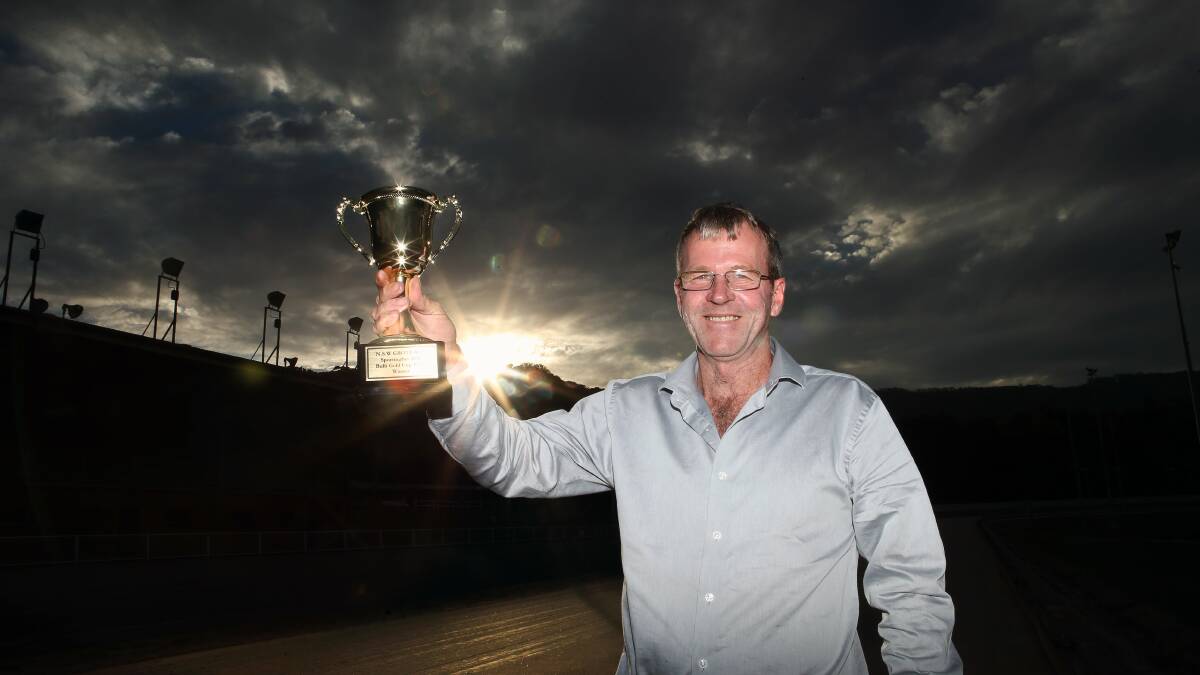 BIG NIGHT: Bulli operations manager Darren Hull holds aloft the Bulli Cup trophy ahead of the final this Saturday night at the northern Illawarra track. Picture: KIRK GILMOUR