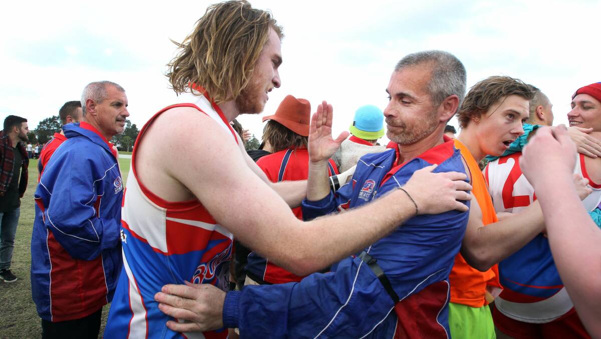 Success: Bulldogs coach Lee Murray (right) celebrates winning the grand final in 2015. Picture: Sylvia Liber