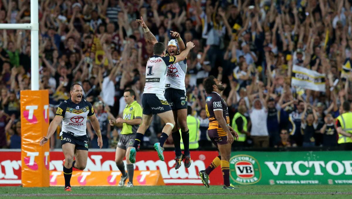 Golden boot: Johnathan Thurston celebrates in 2015. Picture: Johnathan Carroll