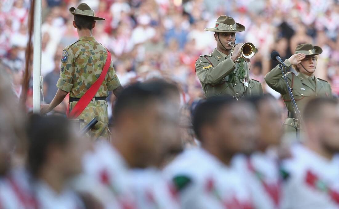 SACRED OCCASION The Last Post is played at last year's Anzac Day clash between St George Illawarra and the Roosters. Picture: Getty Images