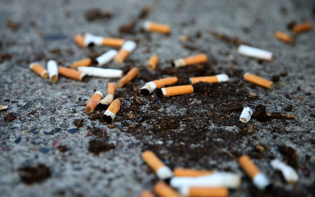 Stop: Cigarette butts tossed from a car will be a demerit point offence from Friday. Picture: Marina Neil