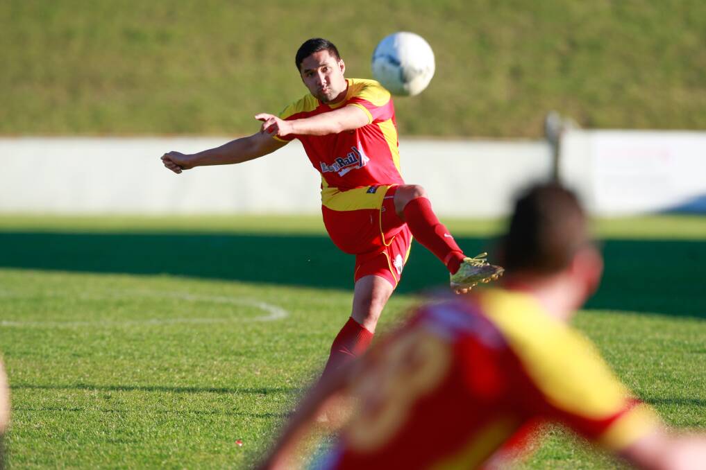 LAST SEASON: Wollongong United's Karouna Micheal plays a long ball. His team had their Fraternity Club Cup final match postponed. Picture: GEORGIA MATTS