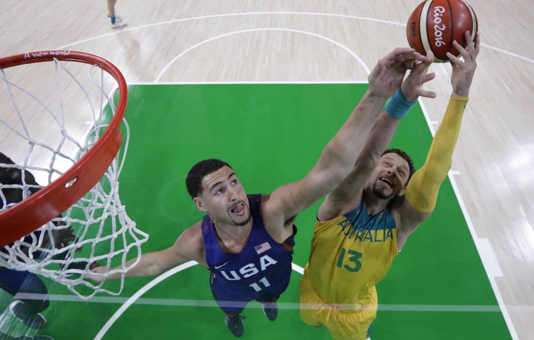 Big time: US player Klay Thompson and David Andersen (13) at the 2016 Olympics. Picture: AP Photo/Charlie Neibergall