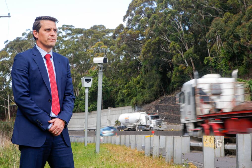 Keira MP Ryan Park in front of the Mt Ousley noise camera, which hasn't issued a single fine since it was installed. Picture: Adam McLean