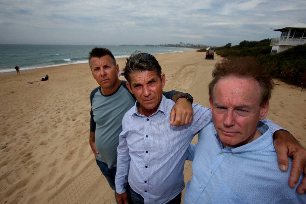 Heartbreak: Cheryl Grimmer's brothers, Stephen Grimmer, Paul Grimmer and Ricki Nash want to see a memorial to their lost sister erected at Fairy Meadow beach. Picture: Robert Peet