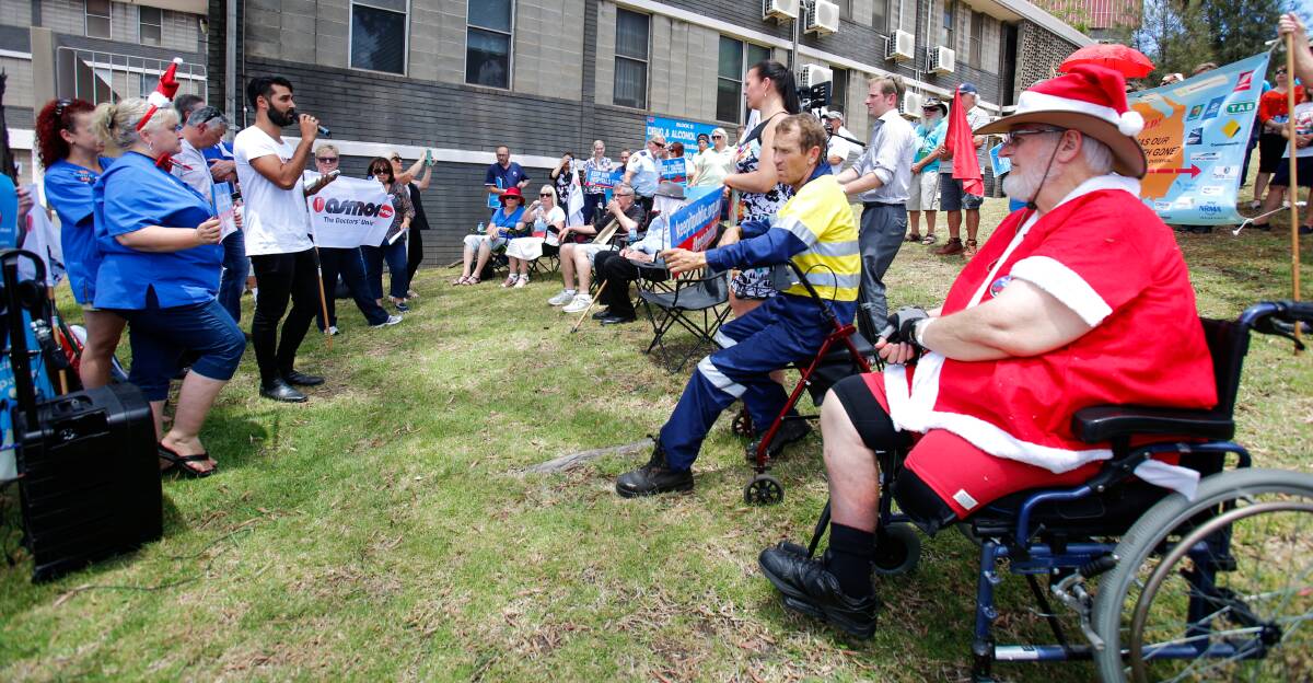 Concerned: Patients such as Dave McCudden (dressed as Santa) are worried about quality of care if the state government part privatises health services.