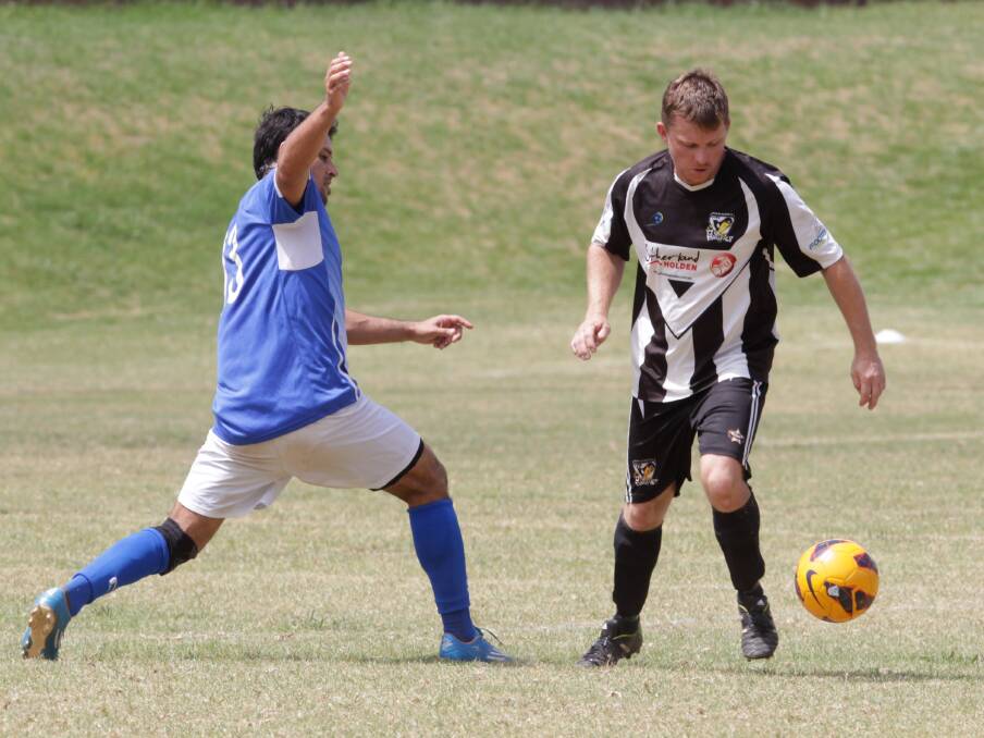 TAKE ME ON: Miranda Magpies player Blake Anderson takes control against The Sydney Brazilian Soccer Club in the Johnny Warren Cup at Jamberoo.
