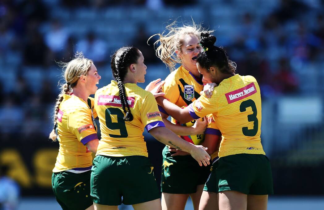 SUCCESS: Kezie Apps (third from left) celebrates with teammates after scoring a try in Sunday's Auckland Nines games against New Zealand. Picture: Getty Images