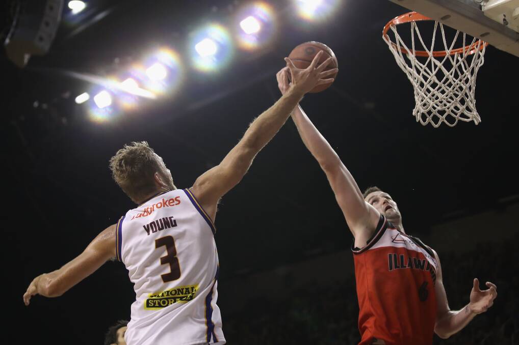 Rising up: AJ Ogilvy takes on the Brisbane Bullets last season. The Hawks first home game is against Brisbane on October 22. Picture: Mark Kolbe/Getty Images