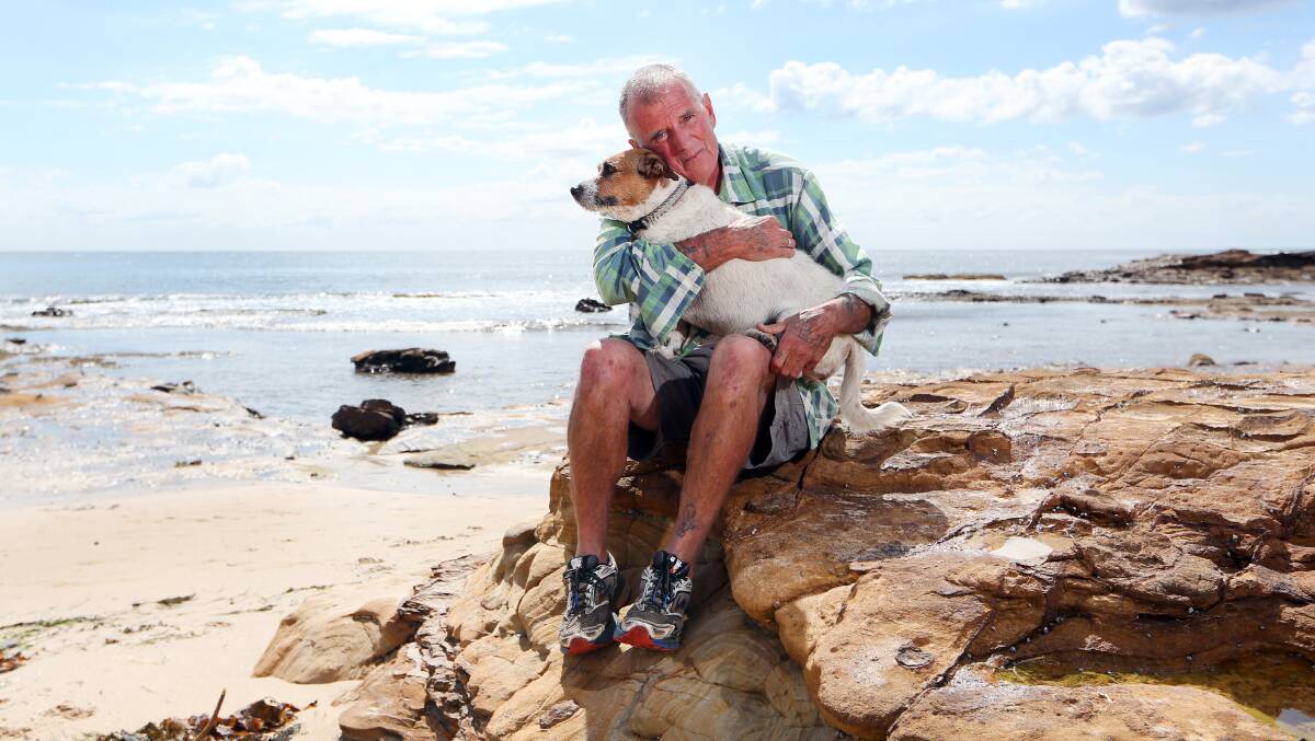 Successful trial: Bill Lenane, pictured with his faithful companion Jedda, was cured of hepatitis C after being treated with a revolutionary new class of drugs. Picture: Sylvia Liber