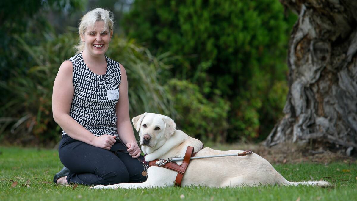 Close bond: Kimberlee Brooker, who lost her sight as a child due to Rod Cone Dystrophy, with her guide dog Toffee. Pictures: Adam McLean 