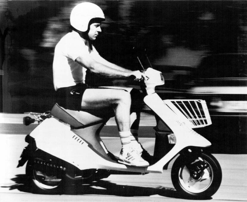 Revs: Swapping a 500cc GP bike for a 50cc scooter, Wayne Gardner gets around Wollongong in 1988. 