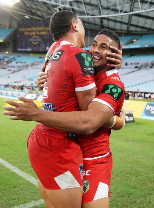 Nene MacDonald celebrates his first try in Dragons colours.