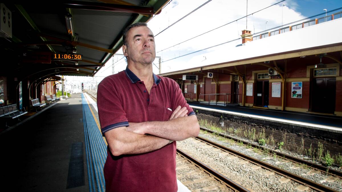 WAITING GAME: Commuter Romeo Cecchele was among those stuck at Wollongong station after their train terminated early. Picture: Georgia Matts