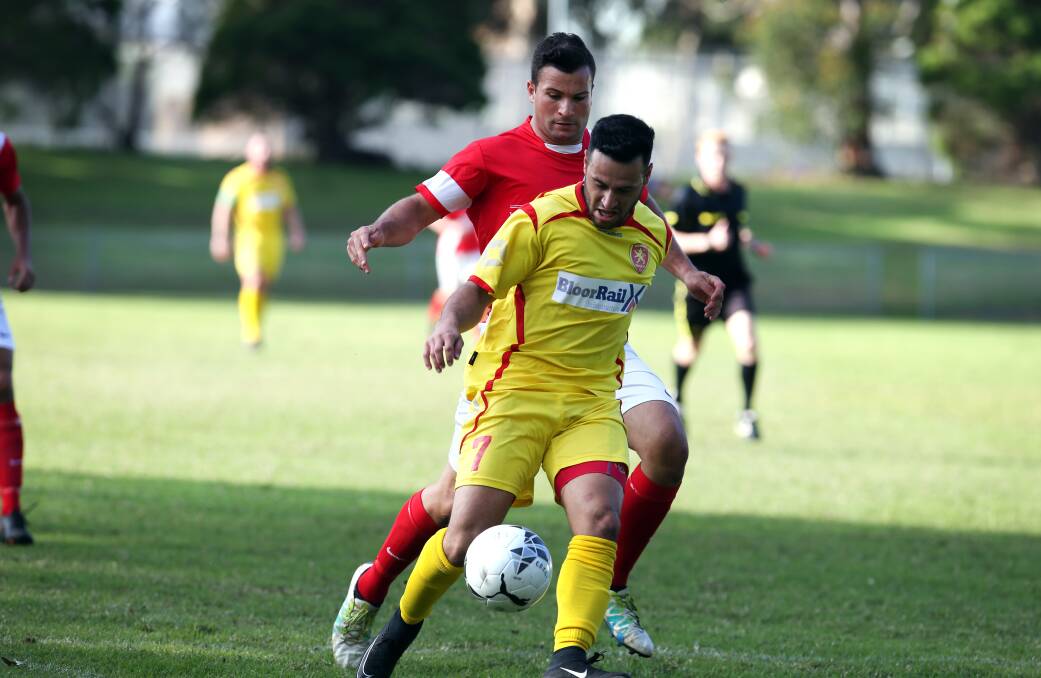 WIN: Corrimal's Robbie Brown (red) earlier this season. Picture: SYLVIA LIBER