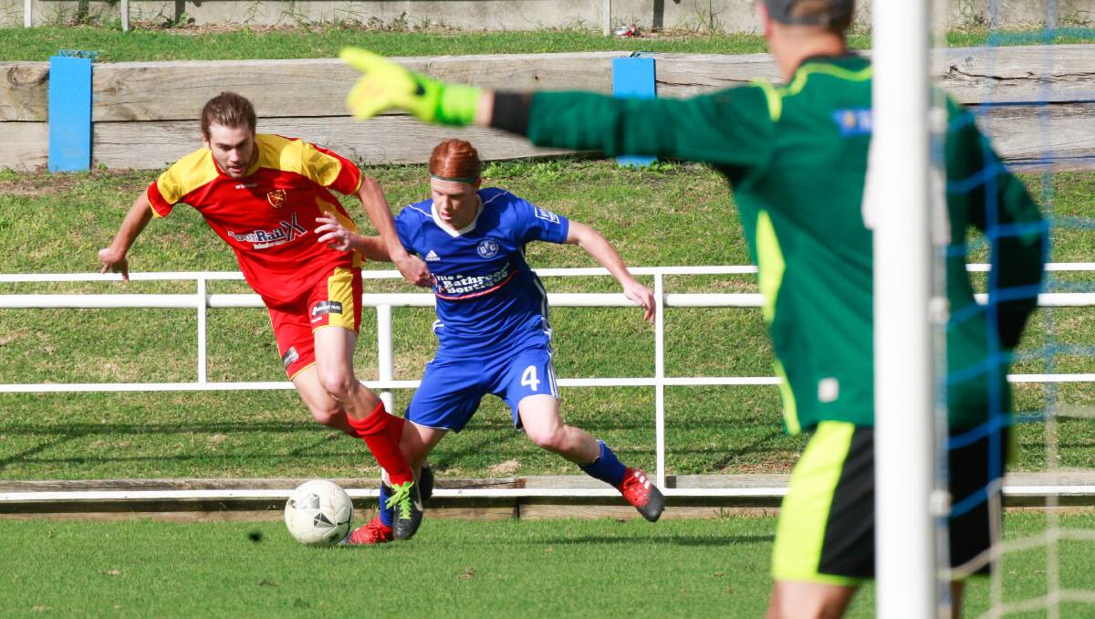 RIVALRY: Wollongong United's Maty Brennan (red) and his teammates are keen to bounce back into form when they meet Kemblawarra Fury. Picture: Georgia Matts