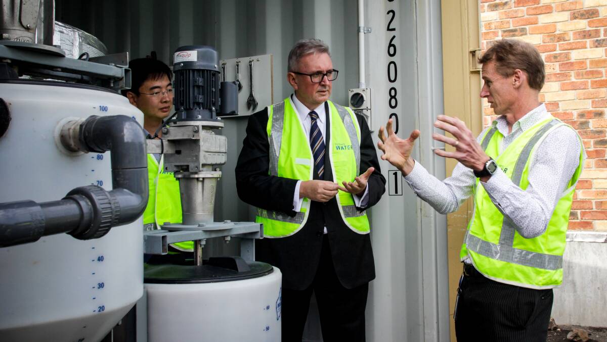 TURNING FOOD WASTE INTO ENERGY: UOW professor Long Nghiem, NSW Minister for Energy and Utilities Don Harwin and Sydney Water's Phil Woods at the Shellharbour Wastewater Treatment Plant. Picture: Georgia Matts 