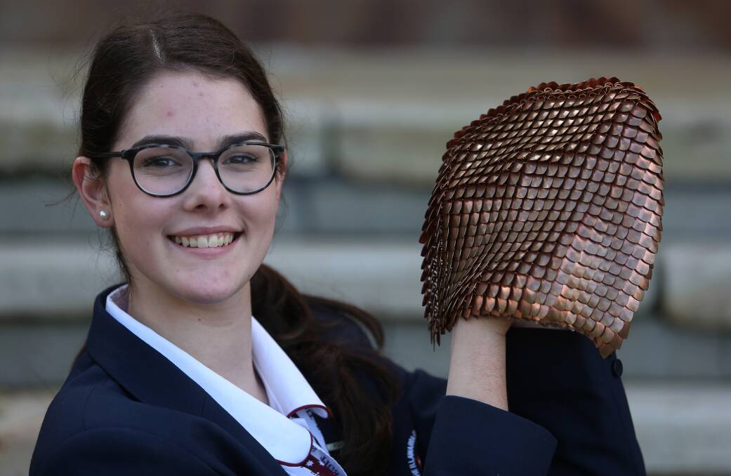 TIGS Year 11 student Macinley Butson with the Smart Armour. Picture: Robert Peet