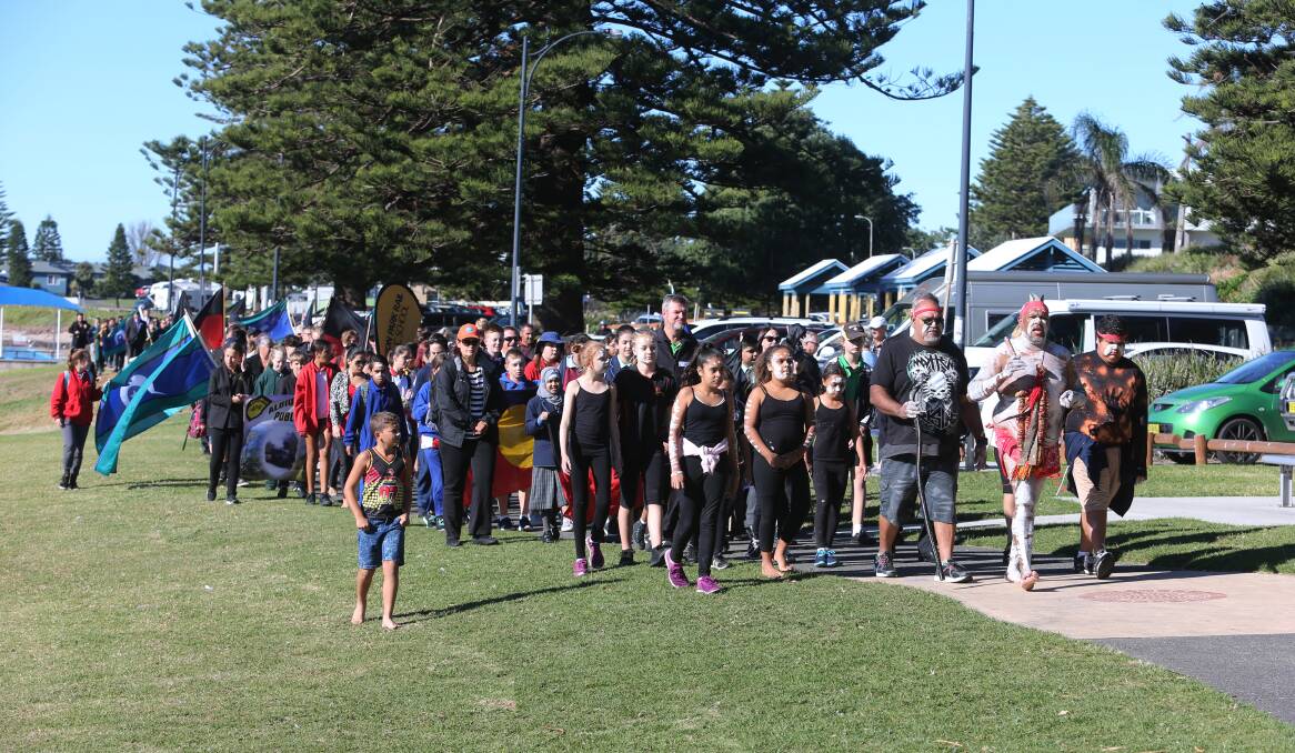 SHOW OF SUPPORT: About 200 students and community members were at Shellharbour Village for the ninth annual walk. Picture: Robert Peet