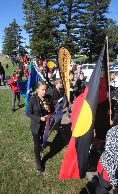 WALKING FOR RECONCILIATION: Students, Aboriginal elders and civic leaders took part in the Reconciliation School Flag Walk. Picture: Robert Peet