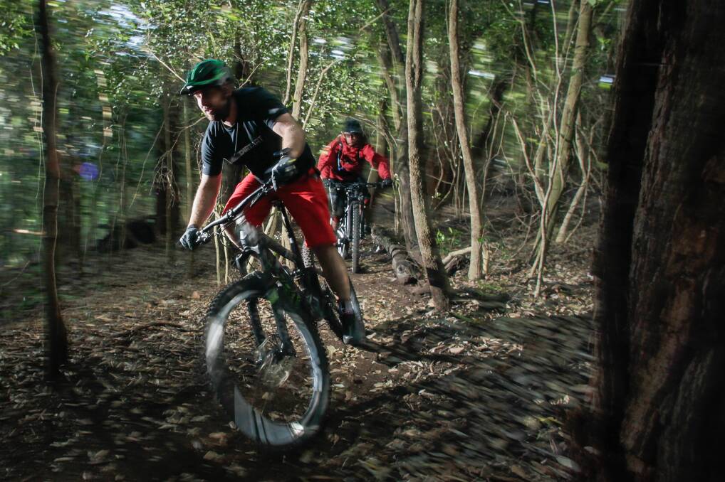  SPEAKING UP: Mountain bikers Gary Pesavento and Jason Lan negotiating some of the local tracks around Mt Keira. Picture: ADAM McLEAN.