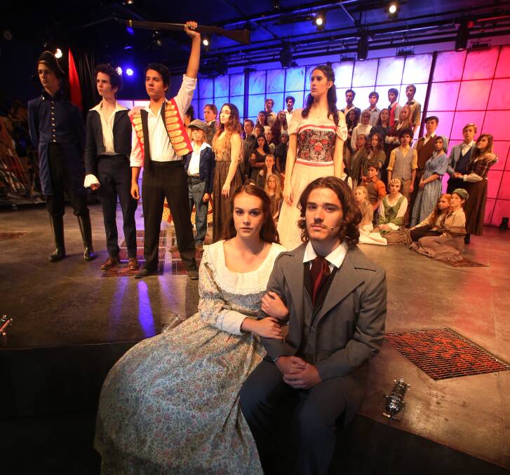 Show time: Jamie Walsh as Cosette and Matthew Hearne as Jean Valjean with the cast of Les Miserables. Picture: Robert Peet