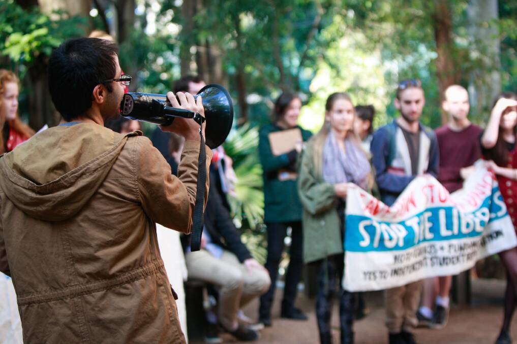 MAKING THEiR POINT: Omar Hassan led a special general meeting and protest of WUSA members at the University of Wollongong. They called for transparency and independent union rights. Picture: Georgia Matts