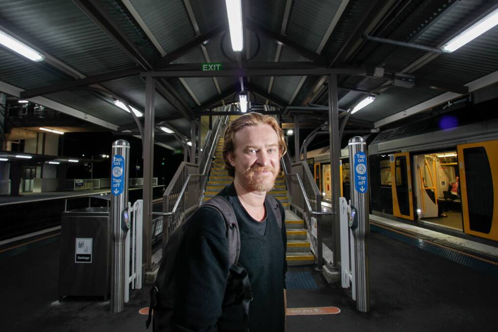 Long haul: Andy Nicholson, pictured after his regular commute at Thirroul train station, says an upgraded rail link to Sydney is smarter than cutting a road through the Royal National Park. Picture: Adam McLean