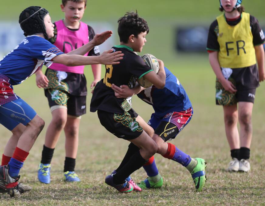 Wrapped up: Nowra East player Keagan Soleburg-McGuiness and Gerringong in the primary schools finals at Albion Park.