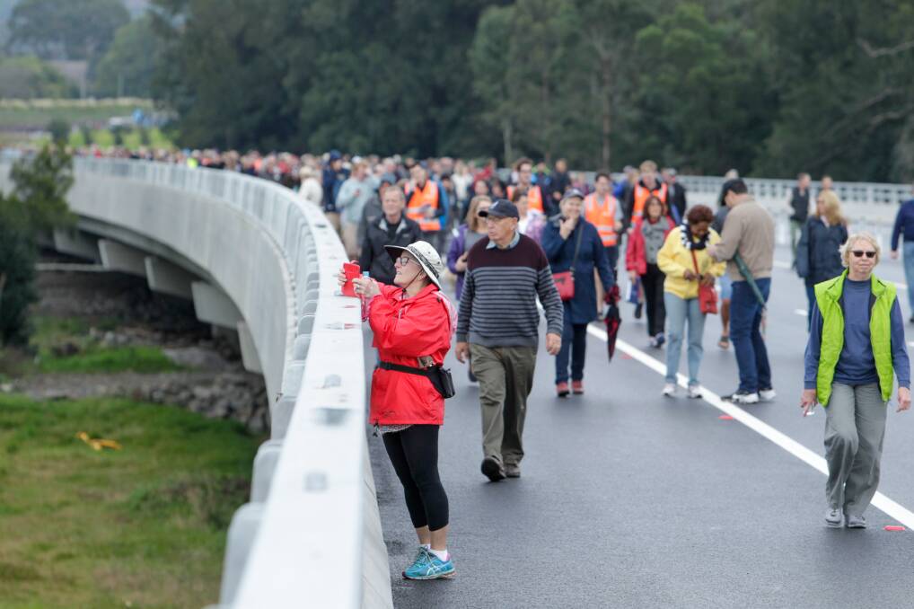 Faster trip: People walk along the Berry bypass in June this year. This summer holiday period is the first since the completion of the bypass. Picture: Adam McLean