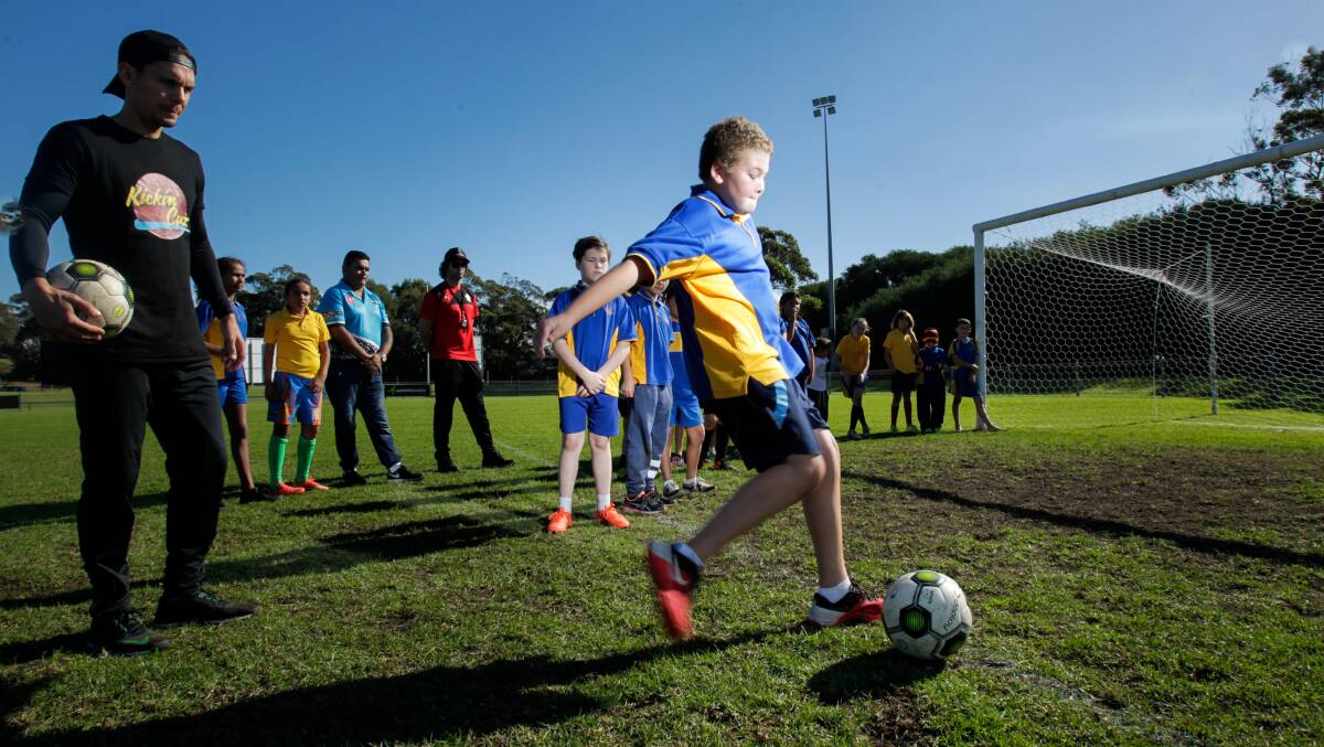 Jade North with kids from Jervis Bay school taking part in the 'Kickin' with a Cuz' football clinic at Albert Butler Memorial Park. Picture: ADAM McLEAN