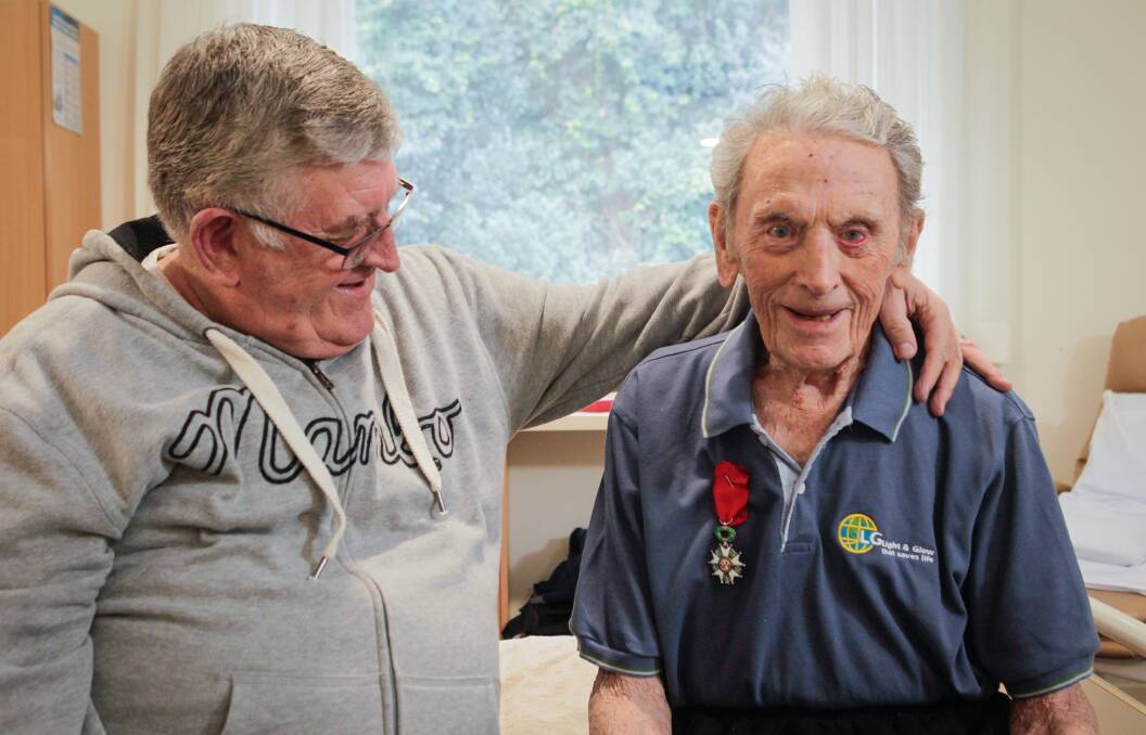 C'EST LA VIE: Roy Pyrah, with his son Derek, wearing his new Legion of Honour medal from France, at the Lawrence Hargrave Private Hospital. Picture: Adam McLean