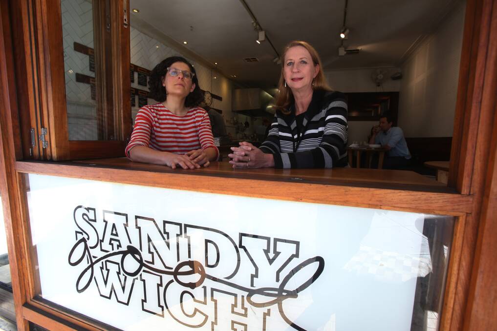 Cunningham MP Sharon Bird with Sandy Goodwich co-owner Emma Huber, who will continue to pay her staff the full Sunday penalty rates, despite the Fair Work Commission ruling that reduced them from this weekend. Picture: Robert Peet