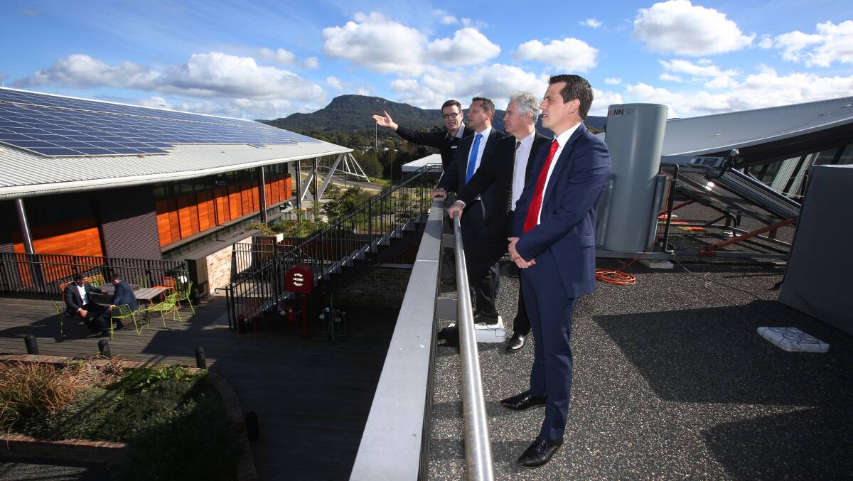 AFFORDABLE SOLAR FUTURE: SBRC research facilities manager Craig McLauchlan, Wollongong MP Paul Scully, Shadow Minister for Energy Adam Searle and Shadow Treasurer, Keira MP Ryan Park. Picture: Robert Peet