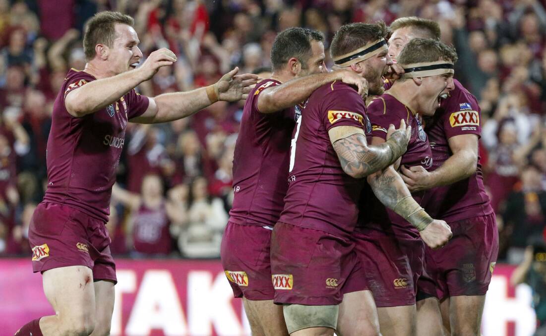 Over: Queensland players celebrare.  Picture: AAP Image/Glenn Hunt