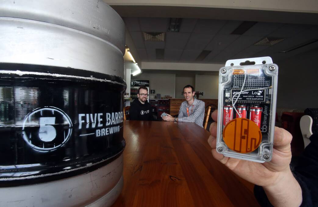 Five Barrel Brewing Phil O'Shea (left) and Binary Beer's Michael Burton have teamed up to trial a device that can track the location and temperature of beer kegs. Picture:  Robert Peet